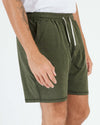Wearing Dark Heather Military Green Active Comfort Short with side pockets.