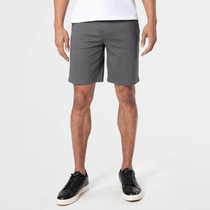True ClassicCarbon Comfort Chino Short worn with black sneakers.
