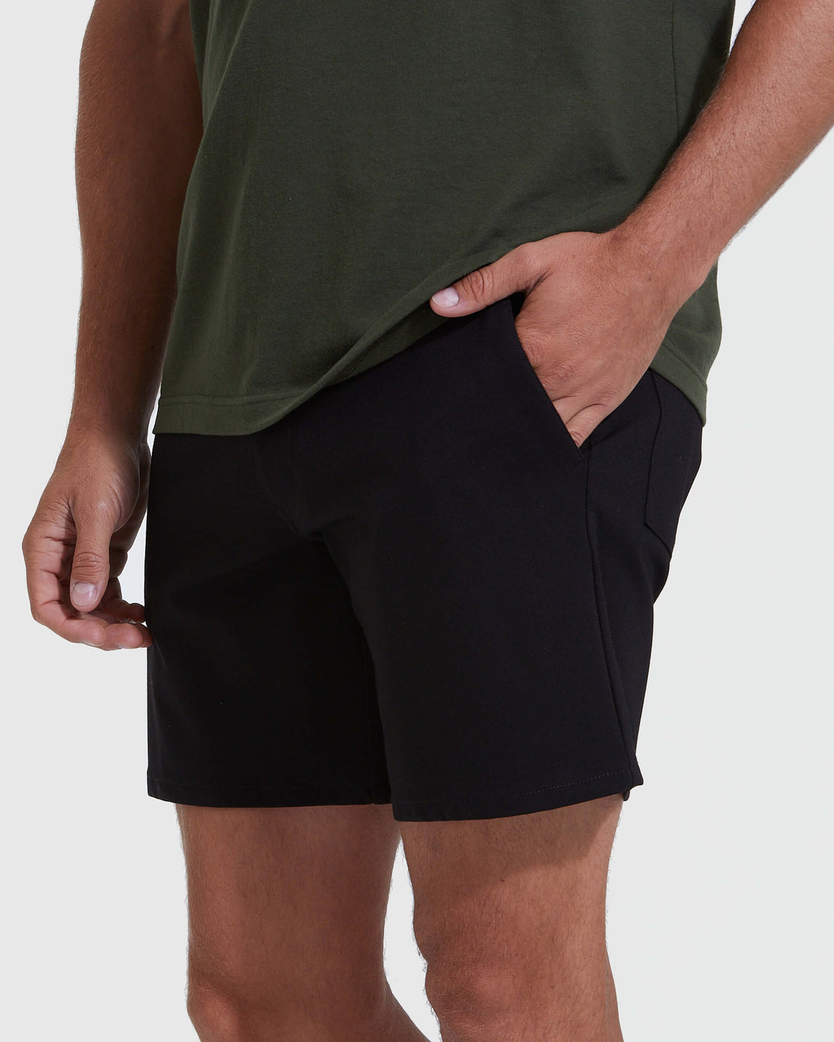 Man wearing Black Commuter Short with hand in pocket.
