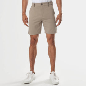7 Neutral Comfort Knit Chino Shorts worn with white sneakers.