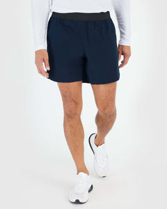 True Classic7 Navy Active Training Short on person walking, showcasing athletic fit.