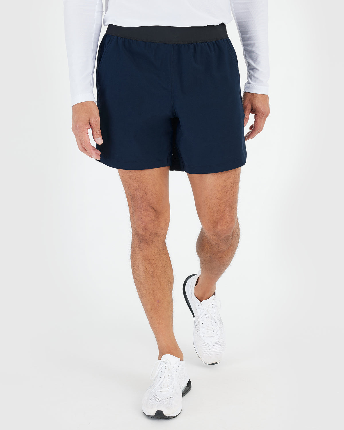Active Crew & Training Short 8-Pack worn, showcasing navy shorts and running shoes.