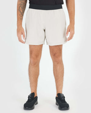 7 Sandstone Active Training Short showcasing breathability and comfort with black waistband.