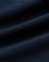7 Navy Active Training Short fabric close-up showing smooth texture and drape.