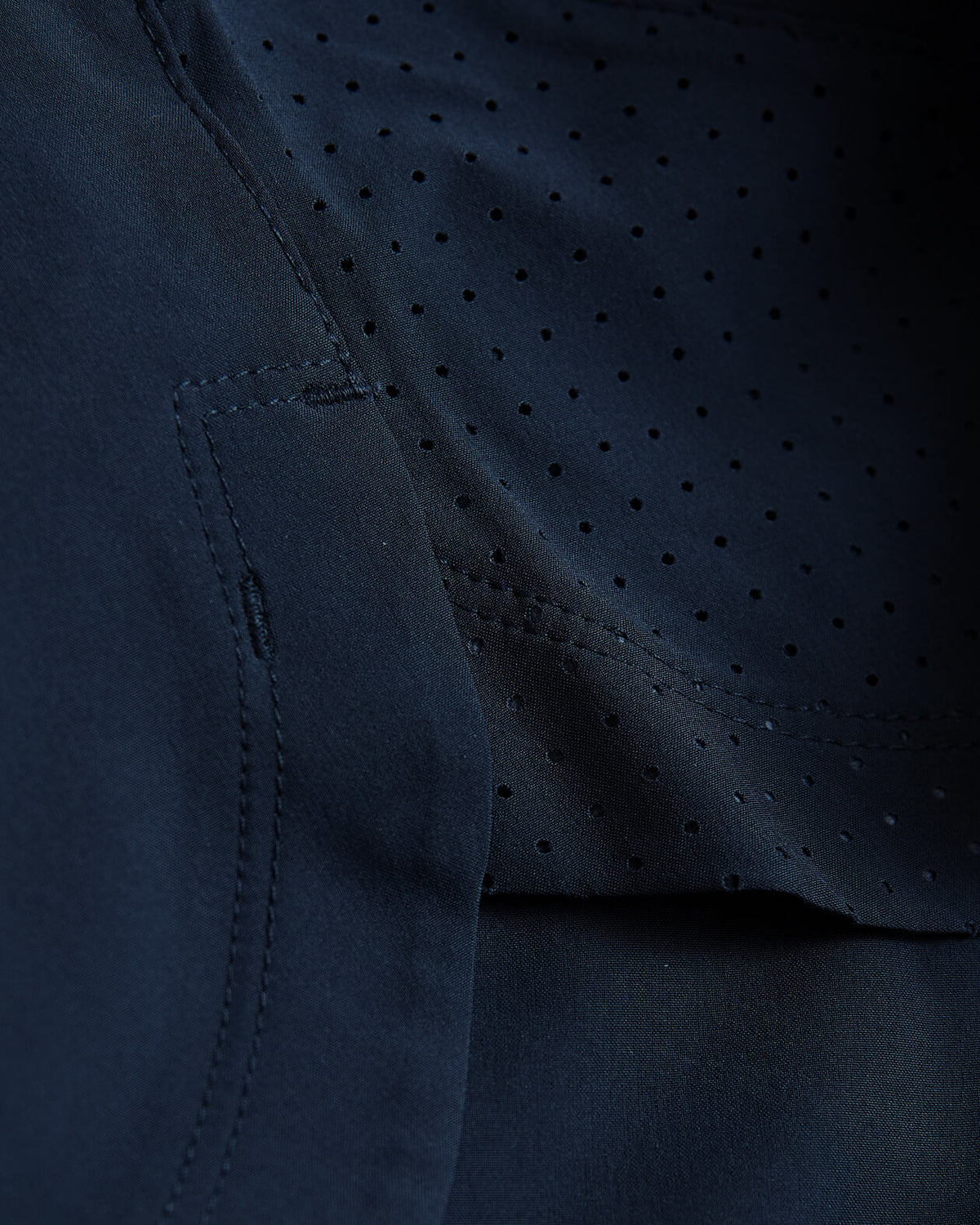 7 Navy Active Training Short with mesh and woven fabric seam detail.