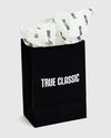 Gift Bag with TRUE CLASSIC logo and tissue paper.