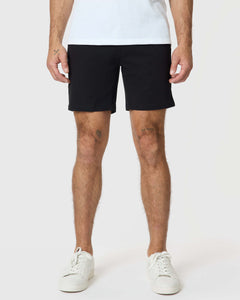 True Classic7 Black Classic Twill Shorts on model with tattoos, white sneakers.
