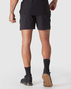 True ClassicBlack 2 In 1 Training Short with gum outsole Adidas sneakers.
