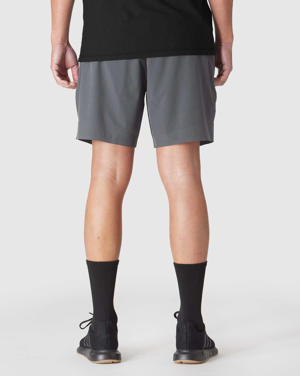 Back view showcasing Carbon 7 2-in-1 Training Shorts.
