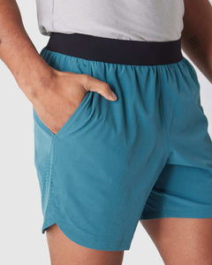True ClassicSapphire 7 Active Training Short with teal color, black waistband, pocket.