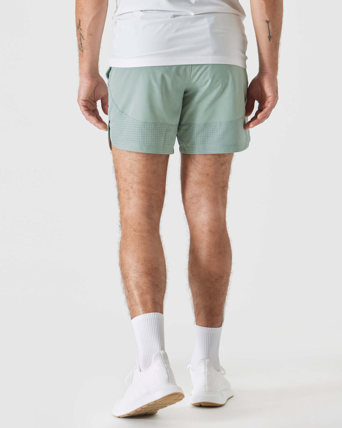 Back view of 7 Slate Green Active Training Shorts 2.0 on a man.