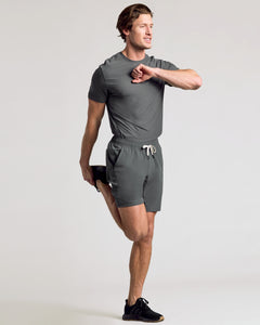 True ClassicMan stretching in 9 All Carbon Active Quick Dry Shorts.