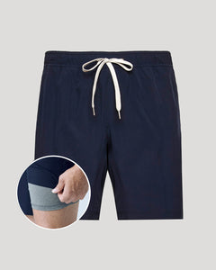 True ClassicNavy blue shorts with a drawstring on a light gray background, with a close-up inset showing a hand wearing a gray sock.