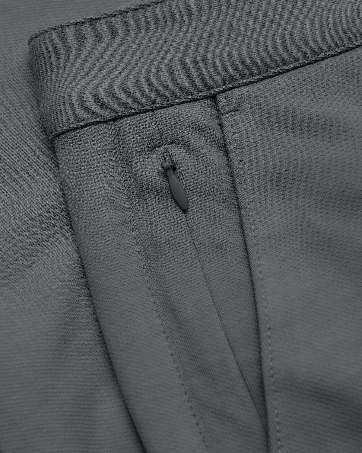 9 Carbon Chino Shorts 2.0 waistband with zippered pocket detail.