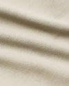 9 Sandstone Chino Shorts 2.0, light-beige woven texture, gentle fabric folds.