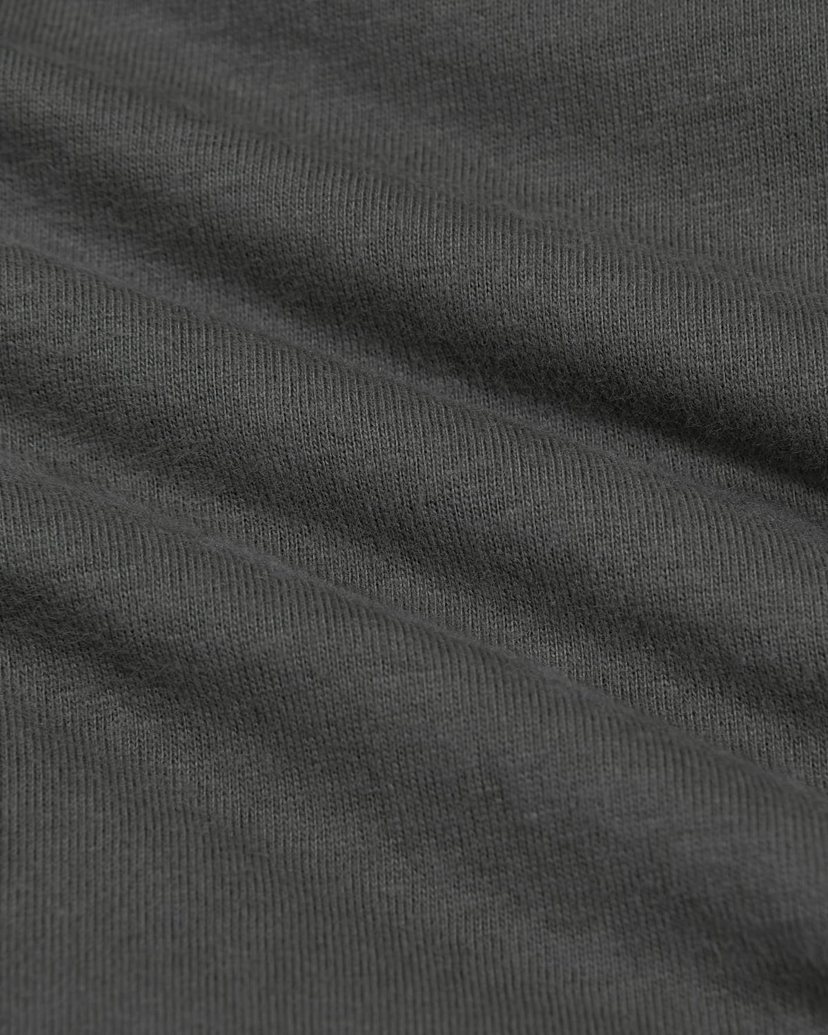 Close-up of dark gray fabric with visible texture