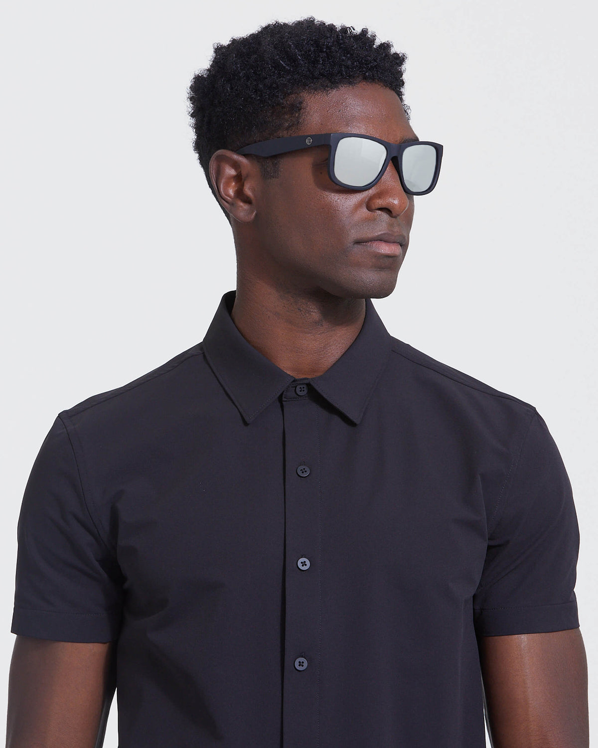 Man wearing Black Mirror Classic Polarized Sunglasses with mirrored lenses.