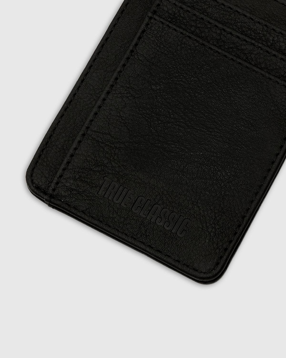 Black Classic Wallet, black vegan leather with TRUE CLASSIC embossed, card slots.