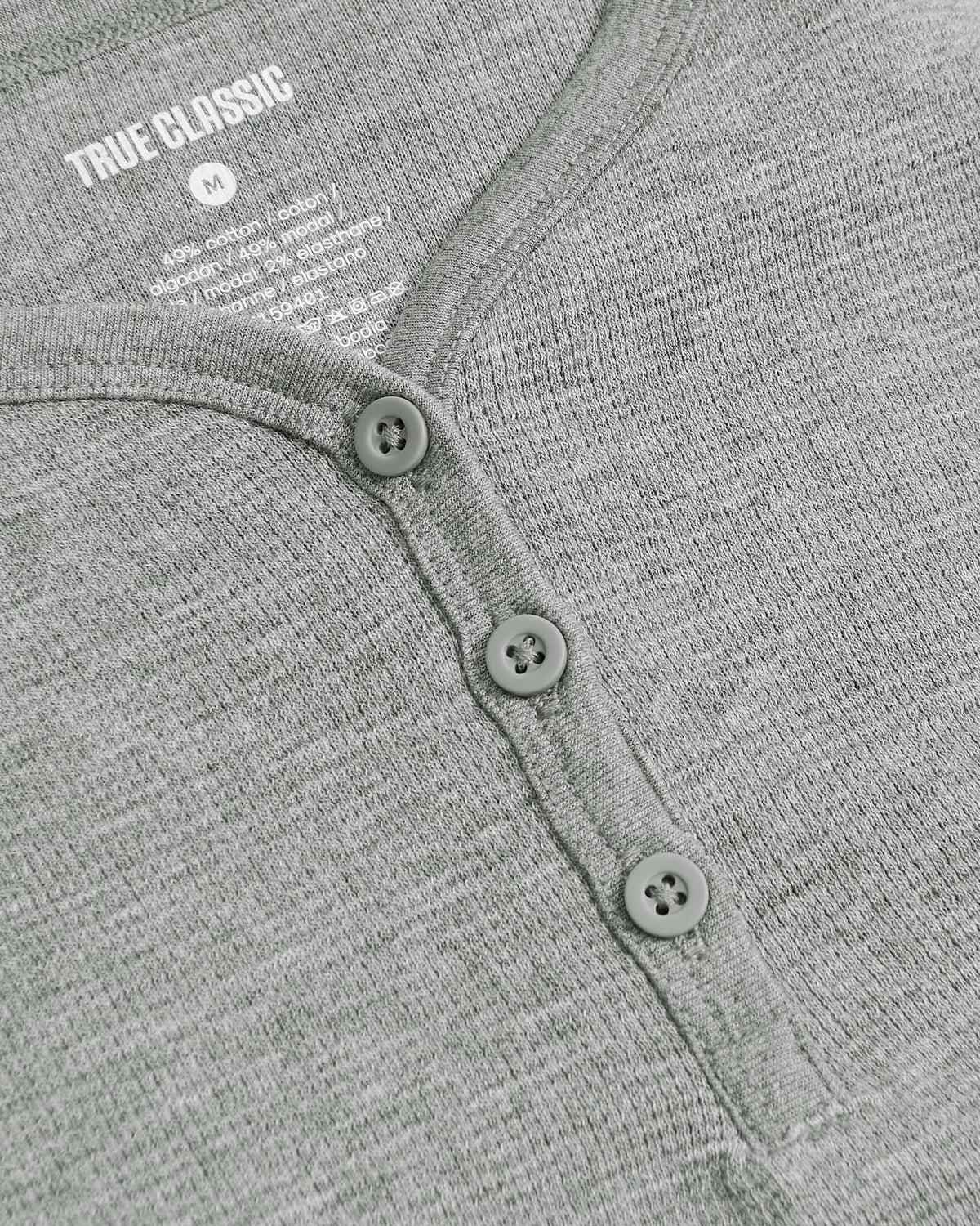 Girls Heather Gray Long Sleeve Boxy Waffle Henley with button-front detail.