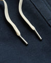 Boys' Navy Full Zip Fleece Hoodie & Jogger close-up of drawcords on fabric.