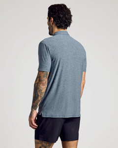 True ClassicMan wearing Heather Navy Active Short Sleeve Polo, showcasing back view and tattoos.