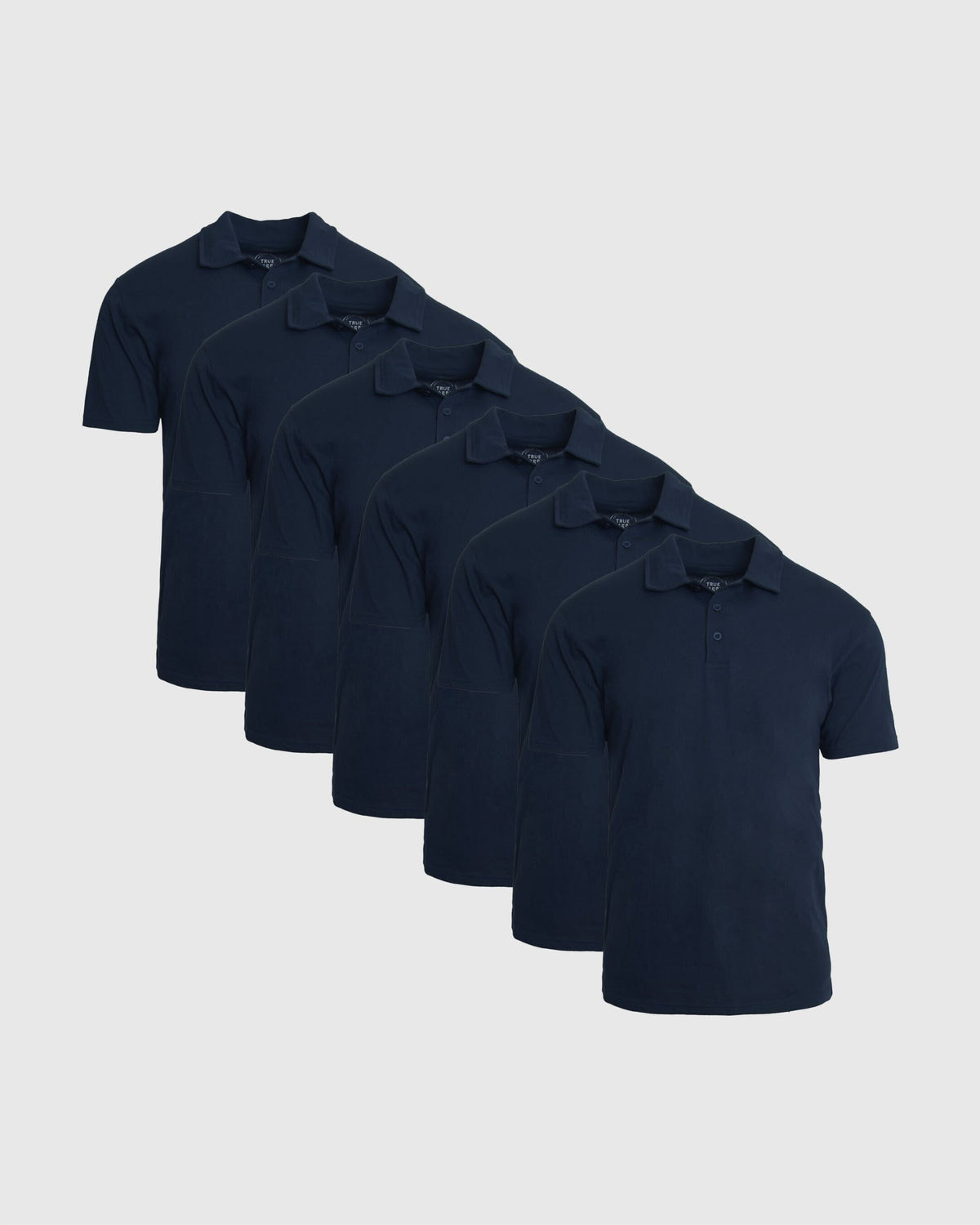 Classic Polo 6-Pack featuring six navy short sleeve polo shirts in a layered display with classic collars and button plackets for men's basics