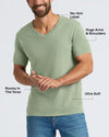 Man wearing a Sage Green Classic V-Neck shirt that features a no-itch label, hugs the arms and shoulders, is roomy in the torso, and made from ultra-soft fabric.