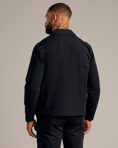 True ClassicMan wearing Black Coaches Jacket, showcasing back design and slim fit.