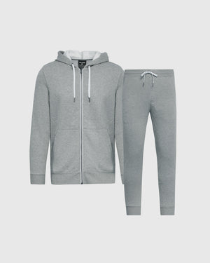 A two-piece gray fleece tracksuit set consisting of a zip-up hoodie with white drawstrings and matching jogger pants, displayed on a light gray background.