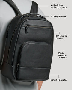 True ClassicPremium Leather Backpack worn over shoulder, showcasing padded straps and trolley sleeve.