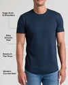 Man wearing a navy crew neck t-shirt with a modern curved hem that hugs arms and shoulders, has a silky smooth feel, and offers a roomy fit in the torso, Tall Pima Cotton Blend Curved Hem Crew 4-Pack.
