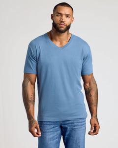 True ClassicIndigo Classic V-Neck worn by man with tattoos.