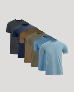 True ClassicSix short-sleeve crew-neck t-shirts in different colors, arranged in a diagonal stack from dark to light. The colors include charcoal gray, navy blue, brown, olive green, medium blue, and light heather blue.