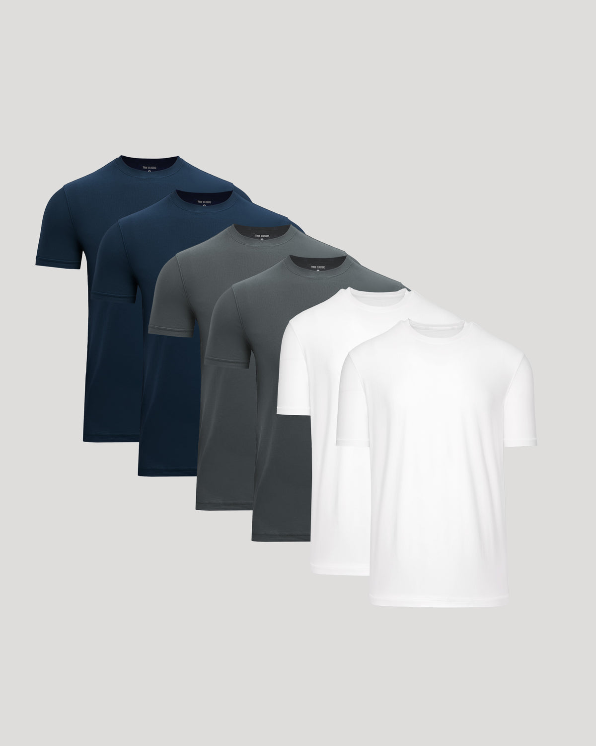 Set of four men's t-shirts in navy, gray, and white on a light gray background