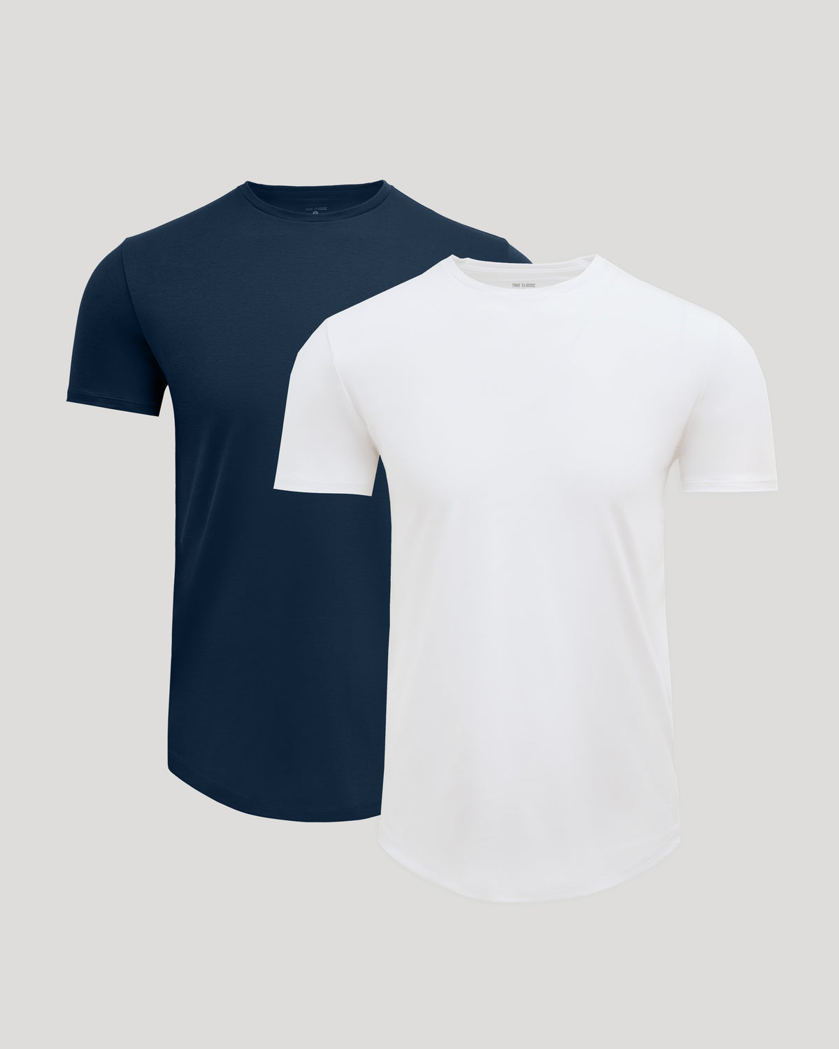 Two men's basic crew neck t-shirts in navy and white, featuring a curved hem, shown as the Pima Cotton Blend Curved Hem Crew 2-Pack.