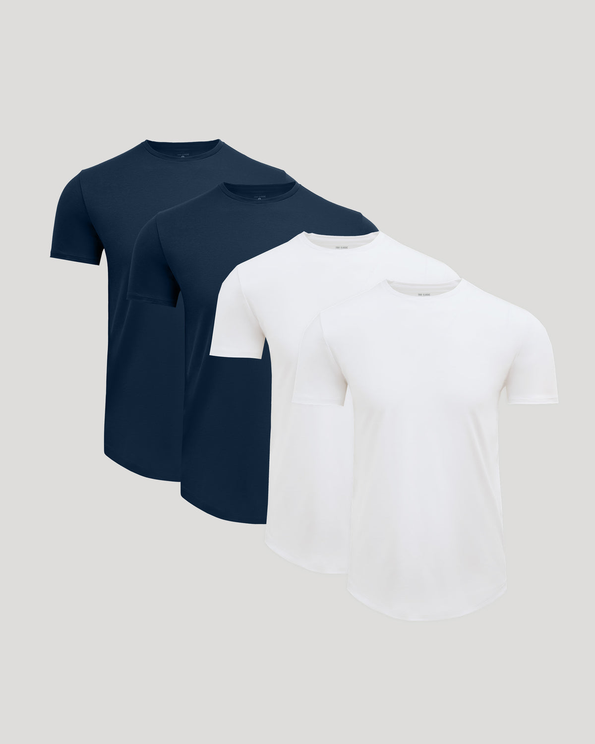 Four men's crew neck t-shirts in navy and white, shown together to display the Pima Cotton Blend Curved Hem Crew 4-Pack, a comfortable men's basics essential.
