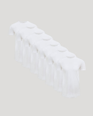 Seven white crew neck t-shirts arranged in a row showcasing the Tall Pima Cotton Blend Curved Hem Crew 7-Pack, a men's basics essential for comfortable everyday wear.
