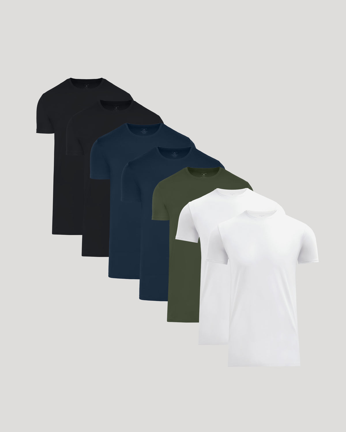 Set of seven men's crew neck t-shirts in black, navy blue, olive green, and white, showcasing the Tall Pima Cotton Blend Crew 7-Pack for essential men's basics by True Classic.