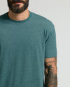 Heather Seafarer Classic Crew Neck on tattooed man, highlighting fit.
