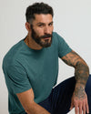 Man in Heather Seafarer Classic Crew Neck with tattooed arm.