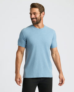 True ClassicMan wearing Heather Indigo Classic Crew Neck and slim-fit black pants.