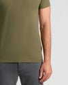 Military green crew neck t-shirt with short sleeves and straight hem.