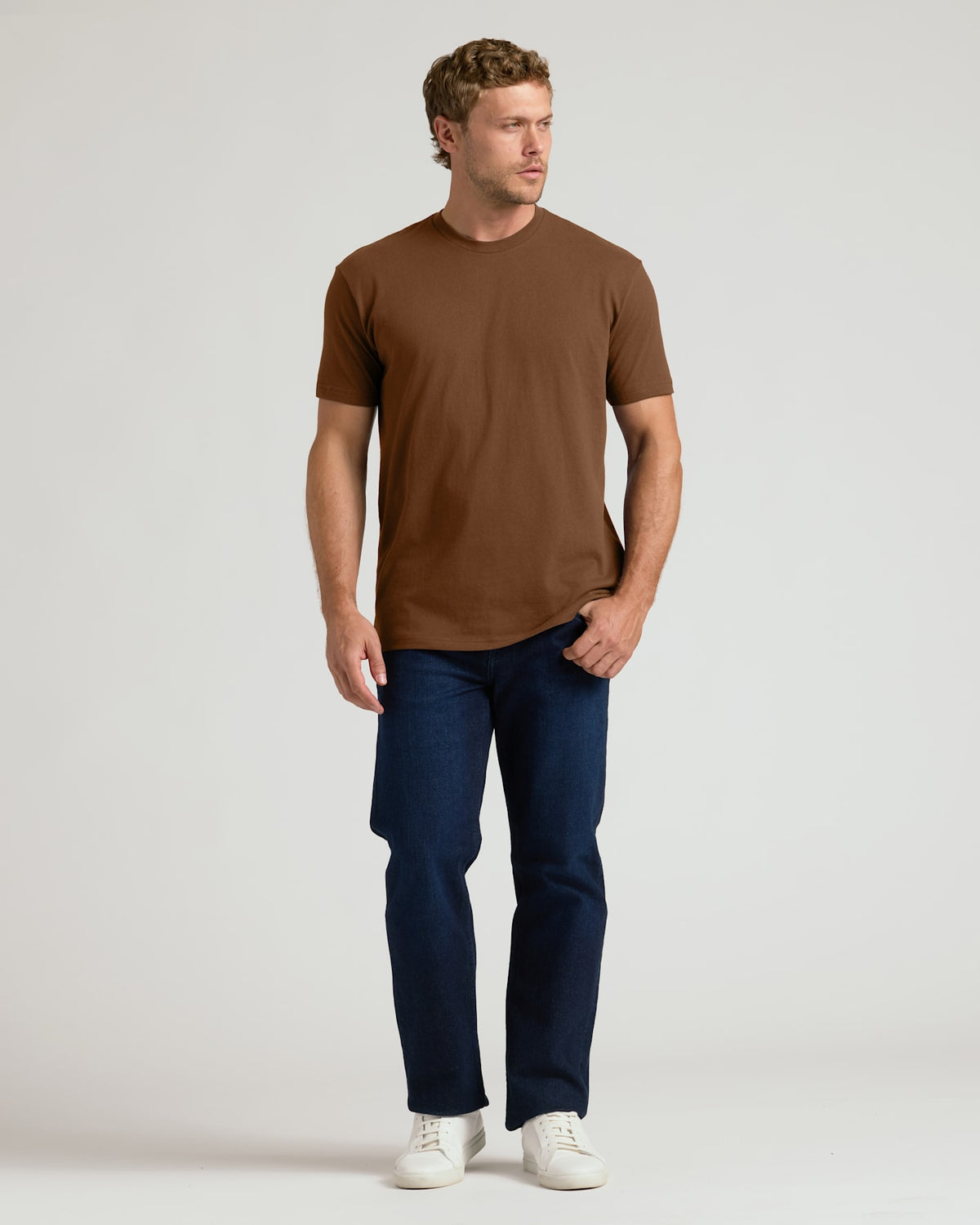 Man wearing Sepiawood Classic Crew Neck T-shirt and jeans.