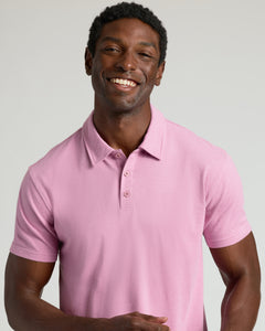 True ClassicMan wearing Heather Mauve Classic Polo, smiling against plain background.