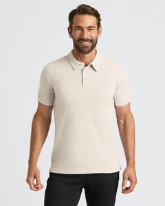 True ClassicMan wearing Oatmeal Classic Polo with a three-button placket, smiling.