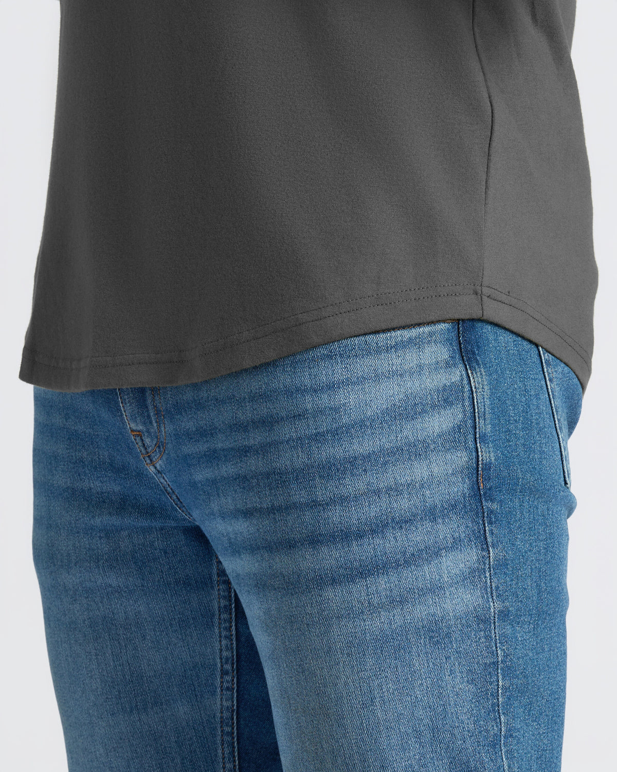Carbon Curved Hem Classic Crew Neck over medium-blue denim jeans.