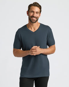 True ClassicMan wearing a dark gray t-shirt on a light gray background