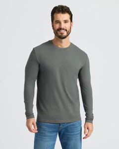 True ClassicMan in Carbon Classic Long Sleeve Crew Neck and jeans, smiling.