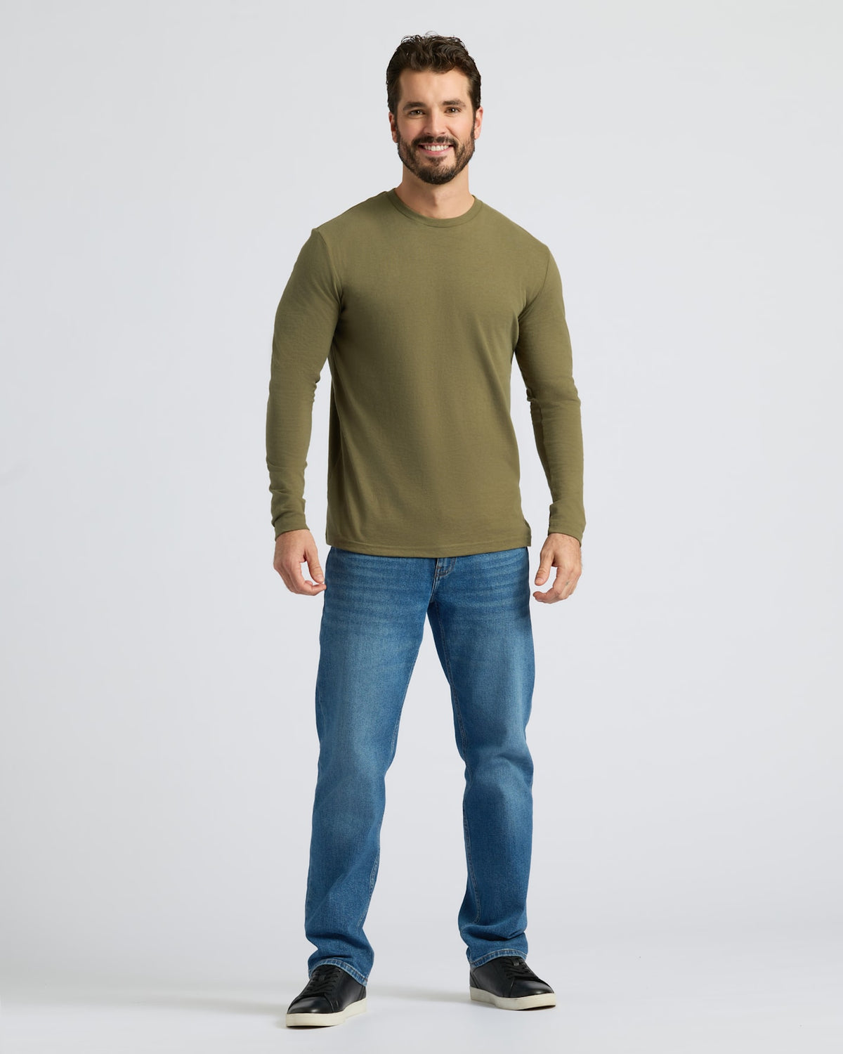 Man wearing Military Green Classic Long Sleeve Crew Neck and jeans.