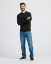 Black Heavyweight Long Sleeve Pocket Crew worn by a smiling man.